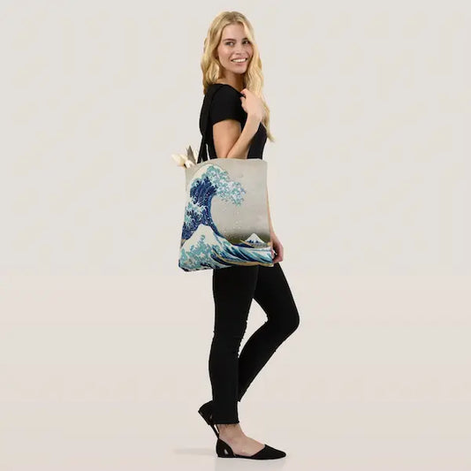 Great Wave Shopping Bag women holding GiftDealAU product image. Woman holding a tote bag with a wave design on a white background