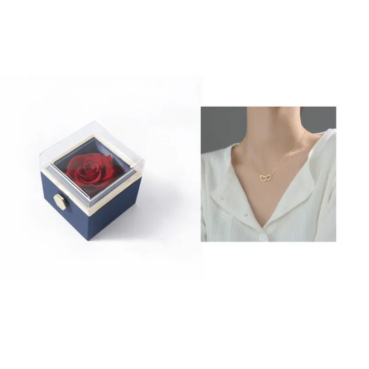 Rotating Eternal Rose Box Square jewelry box with a red rose and a necklace with a heart pendant on a white background