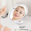 360 Swivel Shower Shaving Mirror Bathroom Person using a handheld mirror with a light source for makeup application, suitable for desktop use.