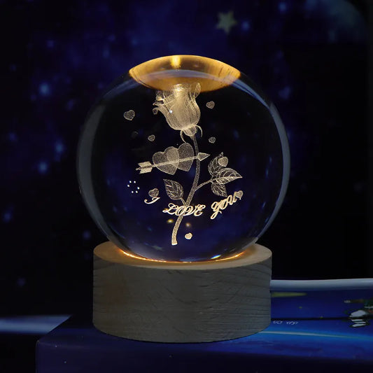 3D Rose Flower Crystal Ball Night Light Decorative glass ball with floral design and 'I love you' text on a wooden base against a dark background.