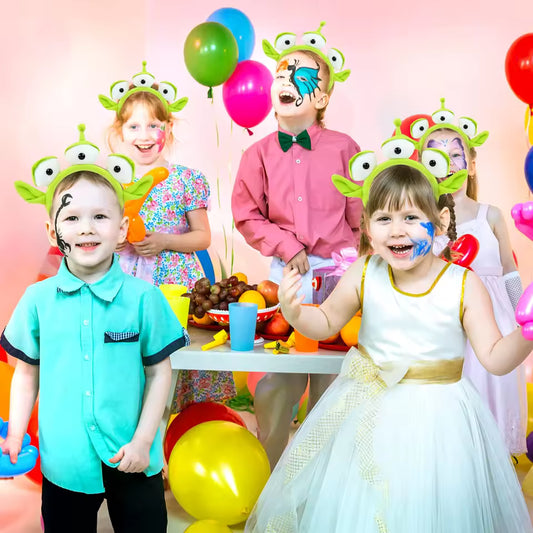 Alien Eyeball Headband A group of happy children at a birthday party wearing green three-eyed alien headbands and face paint