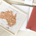 Australia Pin Board Travel Map gift box GiftDealAU product image. Map of Australia on cork board with motivational quote and red notebook.