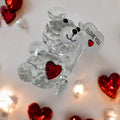 Crystal Clear Glass Bear Statue Crystal bear figurine with 'I LOVE YOU' on a heart, surrounded by red hearts and lights.