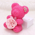 Crystal Diamond Bear Pink glitter teddy bear with a rose on a white background