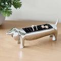 Dachsie Dog Ring Holder GiftDealAU product image. Dog-shaped jewelry holder with rings on a wooden surface