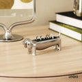 Dachsie Dog Ring Holder GiftDealAU product image.Metallic dog-shaped ring holder on a wooden surface with 'umbra' branding.