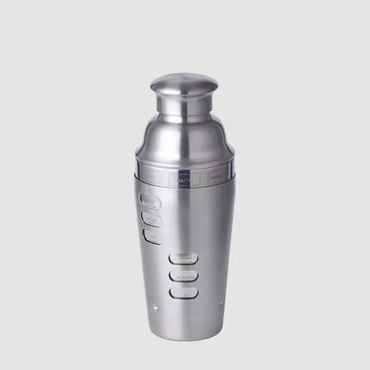 Dial a Drink Cocktail Shaker Stainless steel cocktail shaker on a light gray background