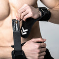 Fitness Weightlifting Hooks
Person wearing black wrist wraps with a visible brand logo on a neutral background