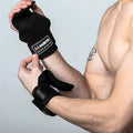 Fitness Weightlifting Hooks Person wearing black wrist wraps with a visible brand logo on a light gray background
