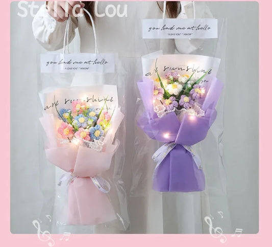 Handmade Crochet Flower Bouquet Two flower bouquets in pink and purple with decorative ribbons and text on a gray background.