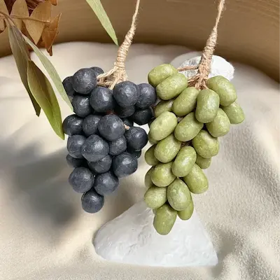 Handmade Grape Soap - Crystal Grape Soap Variant olive and black grapes product image. Decorative hanging grapes on a white pedestal with a neutral background.