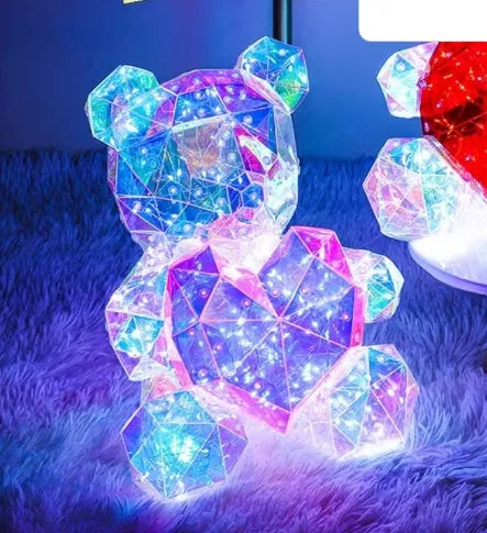 Holographic LED Teddy Bear Colorful geometric teddy bear on a soft blue surface