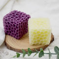 Honeycomb Cube Candle
yellow and purple variant GiftDealAU product image. Two honeycomb-patterned soap bars, one purple and one yellow, on a wooden block with a white background.
