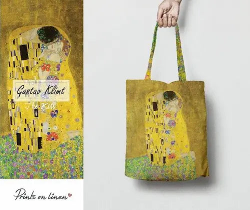 Klimt The Kiss Tote Bag GiftDealAU product image. Tote bag with 'The Kiss' by Gustav Klimt design held by a hand on a white background.