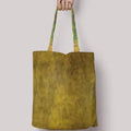 Klimt The Kiss Tote Bag backside GiftDealAU product image. Green tote bag with patterned handles held by a person on a light gray background