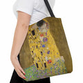 Klimt The Kiss Tote Bag women carry tote bag GiftDealAU product image. Tote bag with 'The Kiss' by Gustav Klimt design held by a person.