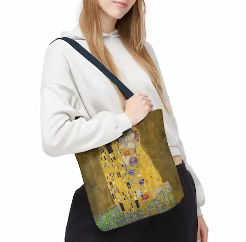 Klimt The Kiss Tote Bag women hanging bag GiftDealAU product image. Person holding a bag with 'The Kiss' by Gustav Klimt design.