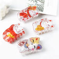 Lucky Cat Hair Claw 4 cats GiftDealAU product image. Four cartoon-style cat figurines with different expressions and accessories on a white surface.