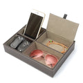 Mens Nightstand Organiser Tray
Grey Organizer tray with compartments holding a phone, keys, sunglasses, and a bracelet on a white background.
