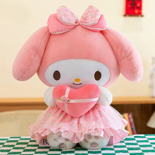 My Melody Heart Plush Toy Pink plush toy with a heart-shaped dress on a checkered tablecloth