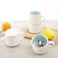 Peekaboo Animal Mug – Cute 3D Hidden Surprise Ceramic Coffee Cup
panda decor variant GiftDealAU product image. Set of ceramic mugs with a panda figurine in one of them, on a light wooden surface.