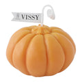 Pumpkin Shaped Soy Candles Pumpkin-shaped candle with 'VISSY' tag on a white background