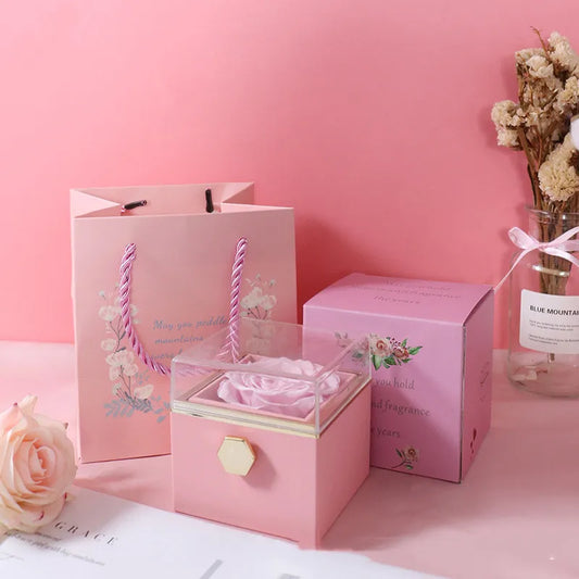 Rotating Eternal Rose Box Pink gift box with a rose on a pink background
