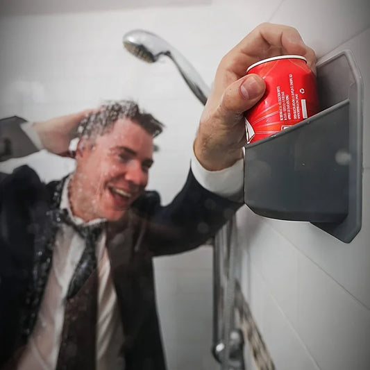 Shower Beer Holder Person holding a red can of Diet Coke in front of a shower head.