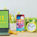 Smiski Hippers Blind Box decor GiftDealAU product image. Laptop, smartphone, clock, and mug on a desk with small green figures around.