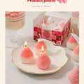 Strawberry Shaped Scented Candles product photo
giftdealau product image. Pink strawberry-shaped candles on a white plate with a decorative box in the background.