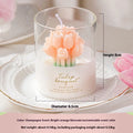 Tulip Bouquet Jar Candle Decorative candle with tulip design in a glass container on a white plate.