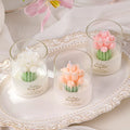 Tulip Bouquet Jar Candle Three small glass candles with floral designs on a decorative tray.