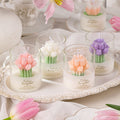Tulip Bouquet Jar Candle holders shaped like tulips on a decorative tray with pink tulips around.