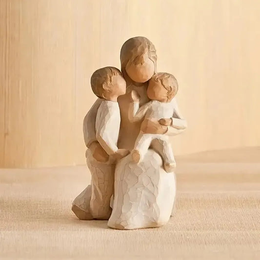 Willow Tree Quietly Figurine Wooden figurine of a family of four on a beige background